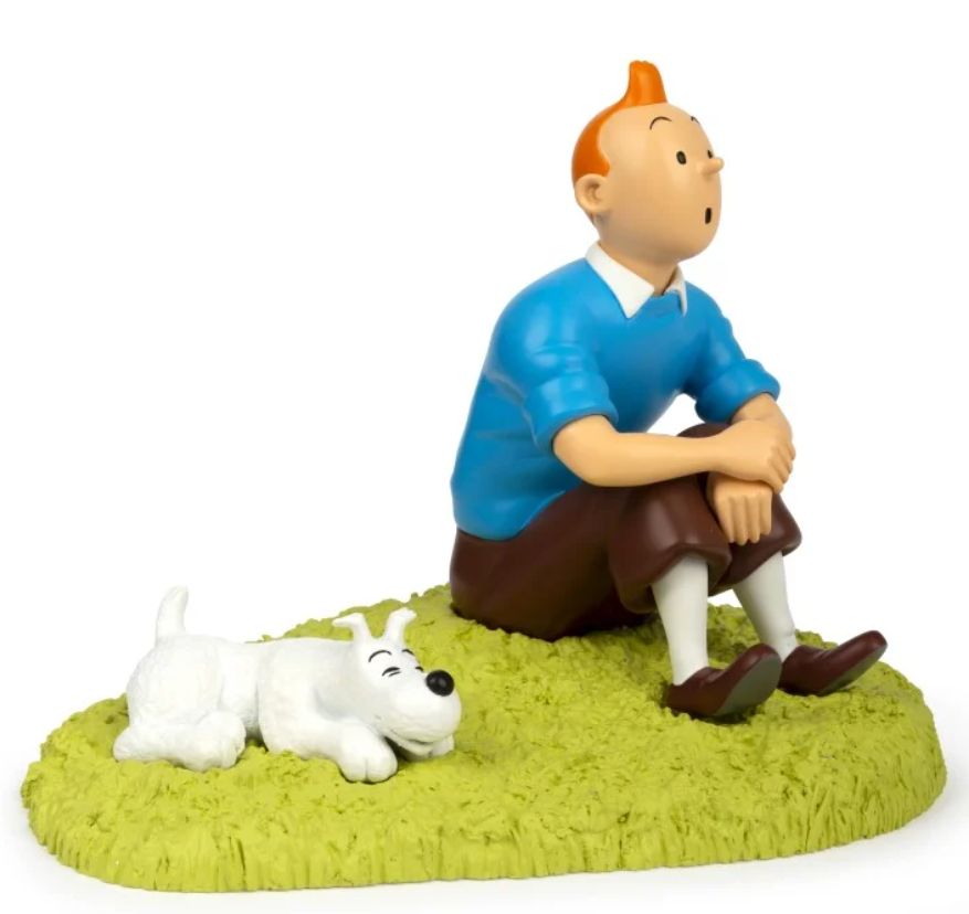 Tintin Figurine résine - Tintin assis dans l'herbe