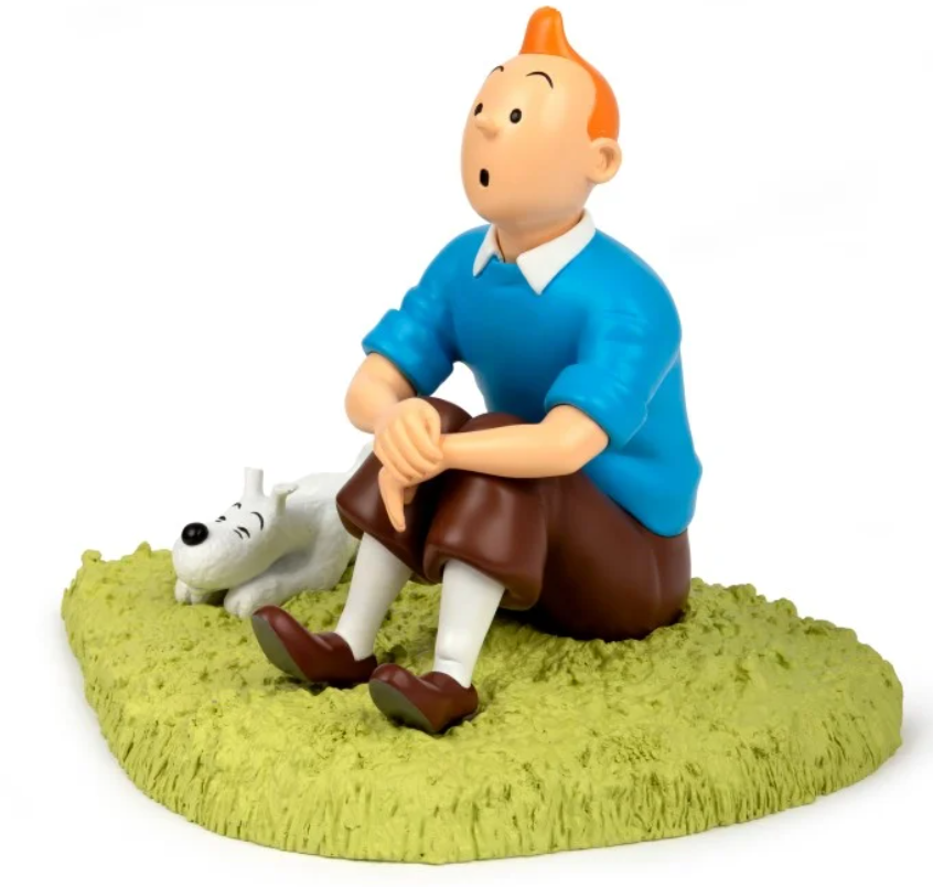 Tintin Figurine résine - Tintin assis dans l'herbe